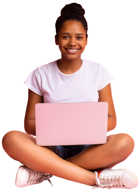 Photograph depicting a student sitting cross-legged with a laptop in their lap, smiling at the camera.