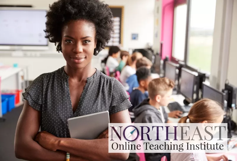 A teacher stands in front of a classroom with their arms crossed, smiling. NEOTI's logo, reading "Northeast Online Teaching Institute" is embedded in the corner.