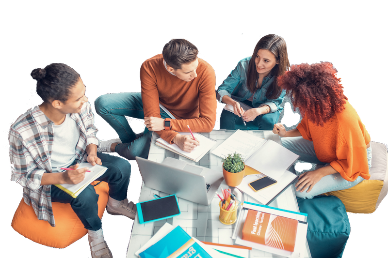 Students discuss and collaborate around a table.