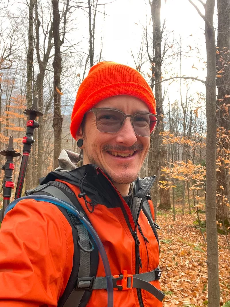 An image depicting VTVLC Teacher Harold Vance hiking in the woods.