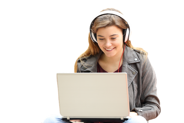 Photograph depicting a student wearing headphones smiling at the laptop on their lap.